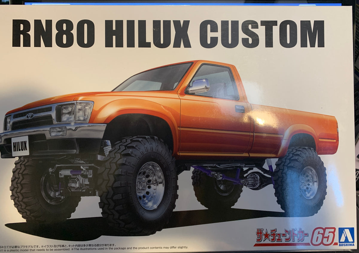 Aoshima #20229 is the 1/24 scale 1995 Toyota RN80 Hilux Longbed Liftup