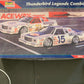 A boxed Revell model car set titled 'Thunderbird Legends Combo' shown on a dark table, with part of a person's legs visible at the right edge.