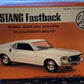 AMT Mustang Fastback #T107, from the Junior Collector Series, is a small 1/43-scale kit