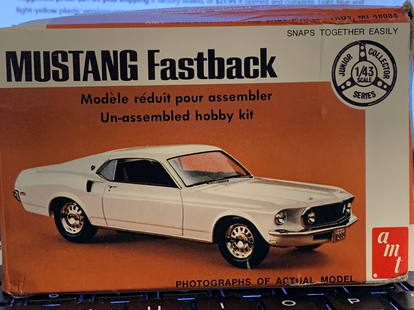 AMT Mustang Fastback #T107, from the Junior Collector Series, is a small 1/43-scale kit