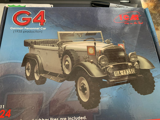 A boxed model car kit labeled G4, showing a vintage off-road car illustration on the front. The box has blue and red graphics and visible text including '1:24 scale special car' and 'G4'.
